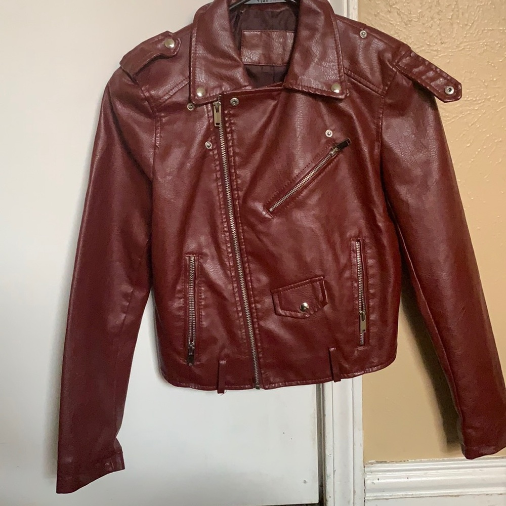 Maroon leather jacket.